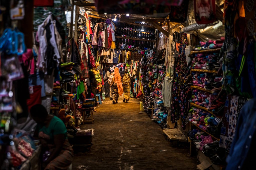 Shops in Toi Market, an open air market and favorite spot to pick up second hand home goods, clothes, shoes, or just fresh fruit and vegetables in Nairobi, Kenya. Source: Flickr